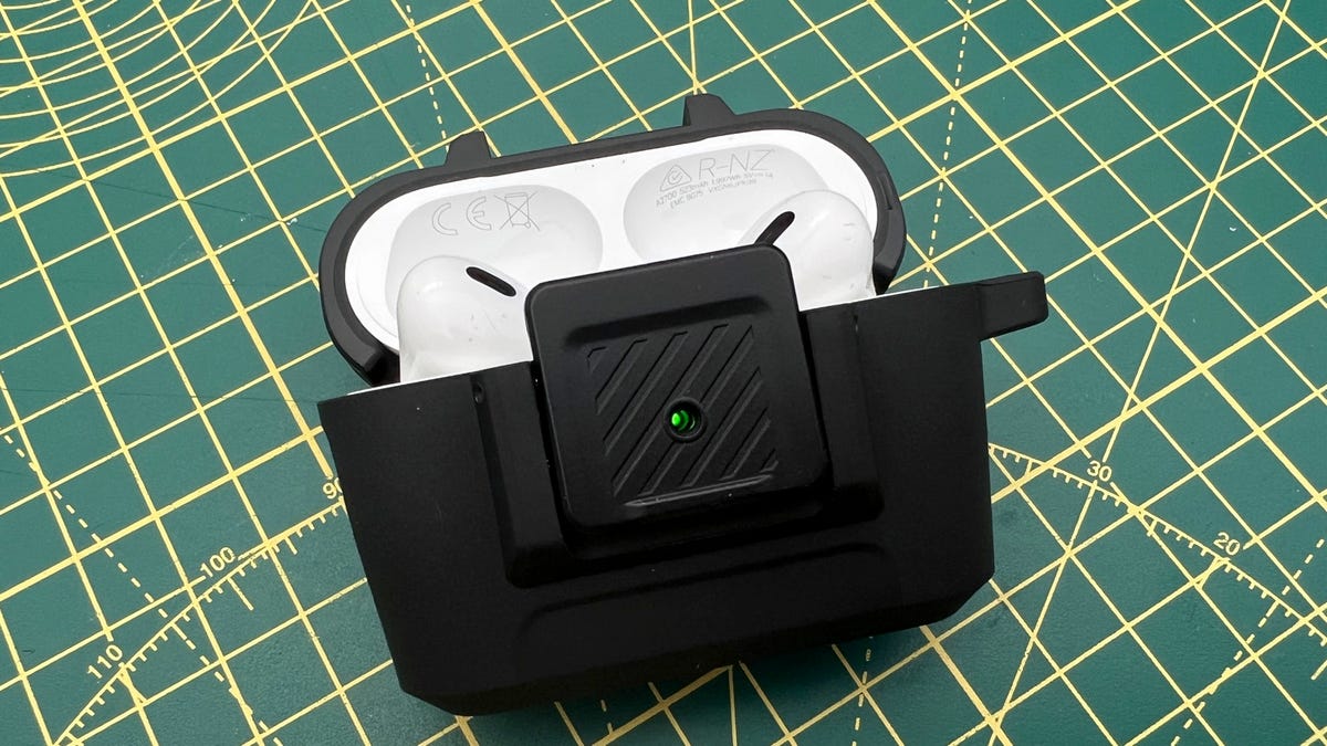 New York News AirPods Pro in the Spigen Lock Fit AirPods Pro case on green and yellow background.