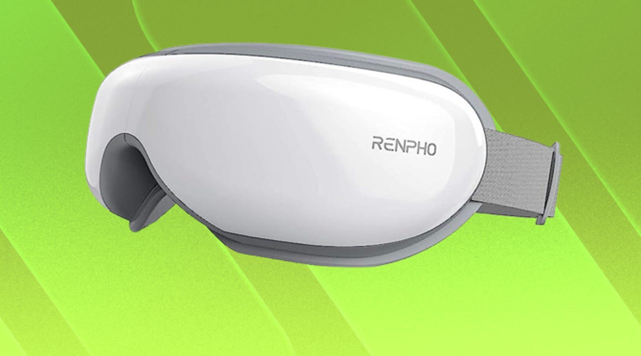 White Renpho eye massager mask against a green background