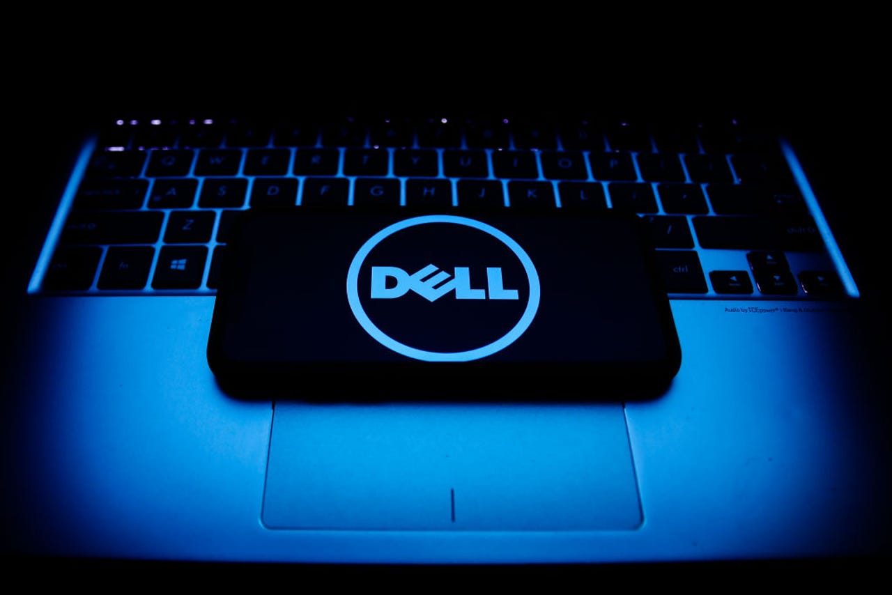 A glowing Dell logo on a laptop.