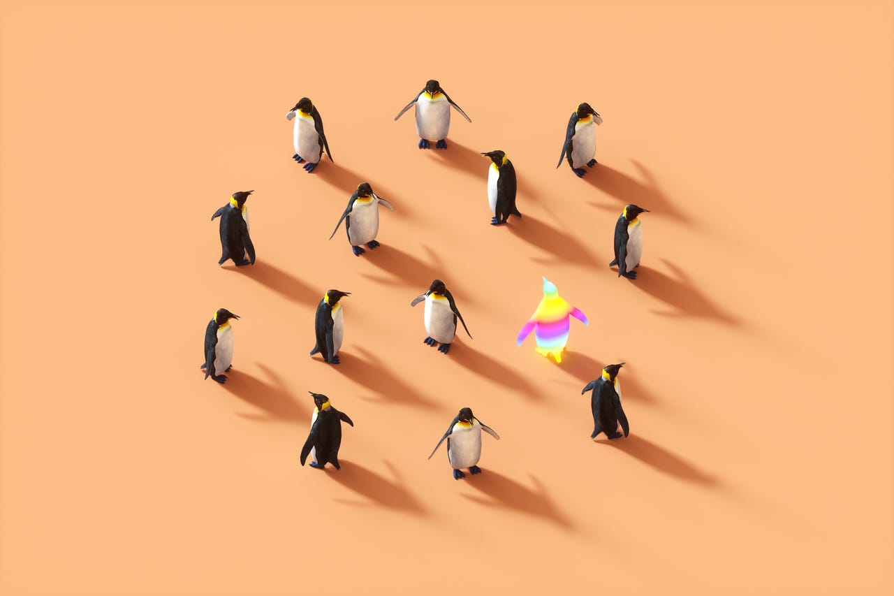digitally generated penguins on orange background
