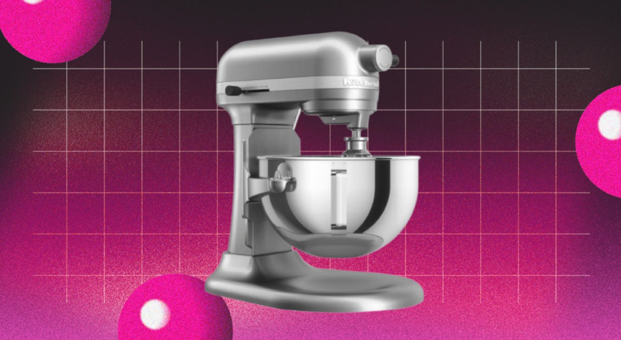 KitchenAid stand mixer against pink backdrop