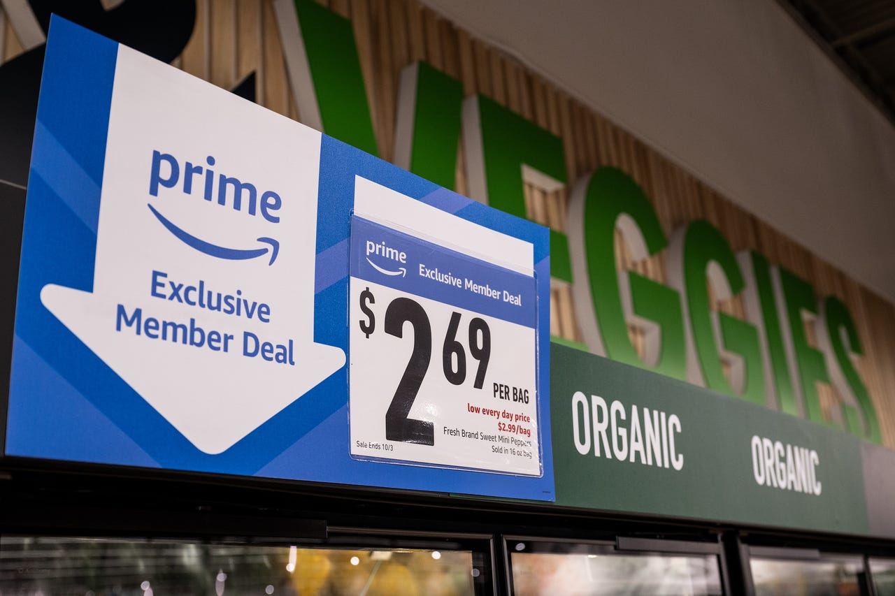 A sign informs customers of exclusive deals for Prime members at an Amazon Fresh grocery store in Schaumburg, Illinois, US, on Monday, July 24, 2023. Amazon.com Inc. is launching the biggest overhaul of its grocery business since it acquired Whole Foods M