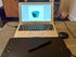 Wacom Intuos Pro connected to a Macbook Air with a drawing of a blue cup on its screen