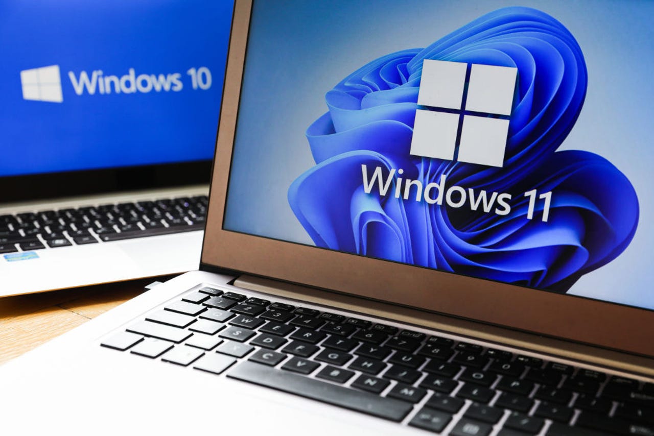 Windows 11 and Windows 10 operating system logos are displayed on laptop screens