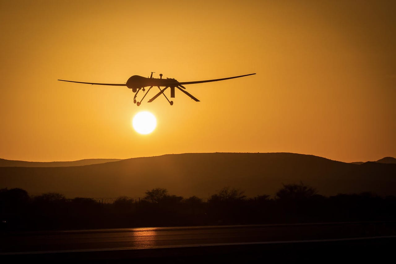 unmanned drone low pass in sunset panorama landscape